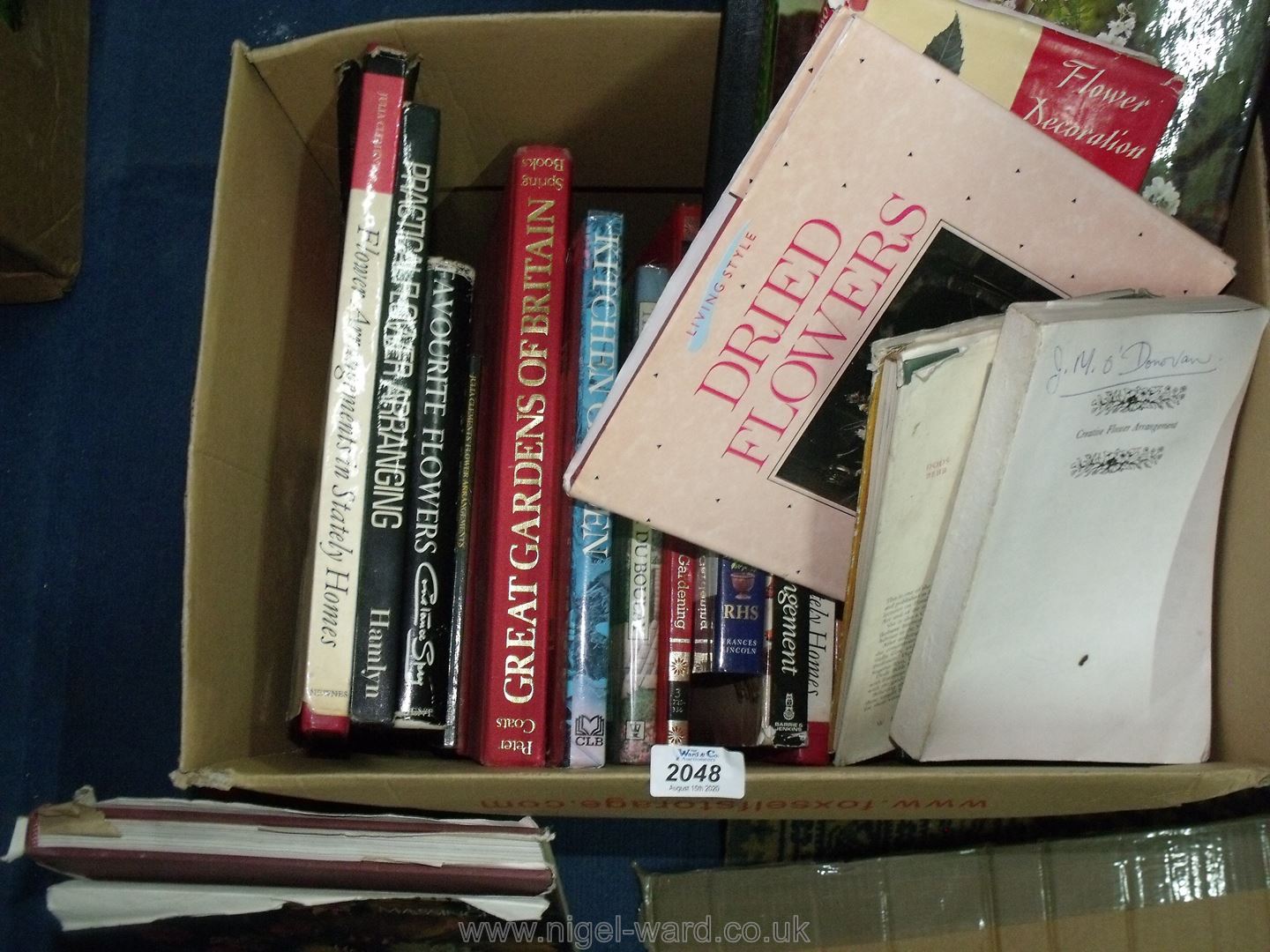 Box of books on gardening and flower arranging.