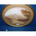 An oval framed and mounted Watercolour of Lake District lake scene.