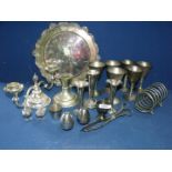 A quantity of plated items including goblets, candlesticks, posy vases, toast rack and tray.