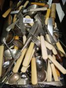 A quantity of mixed cutlery, bone handled knives, forks,