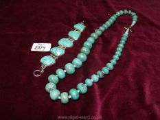 A turquoise necklace and bracelet.