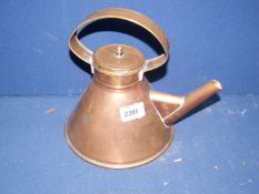 A Victorian copper kettle.