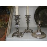 A pair of candlesticks of silver plate on copper adapted for electricity and one other.