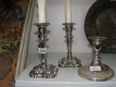 A pair of candlesticks of silver plate on copper adapted for electricity and one other.