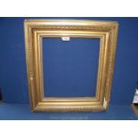 A heavy Victorian gilt gesso frame,