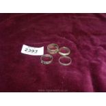 Four silver band style rings.