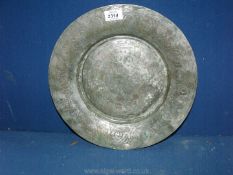 An antique 12th Century tinned copper Middle Eastern plate.