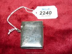 A Birmingham 1911 hallmarked silver Vesta with diagonal section of filigree decoration, initials T.