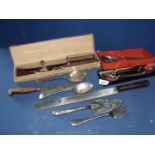 A quantity of cutlery including long carving knife with wooden handle, Sabatier style cooks knife,