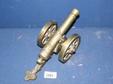 A brass cannon, 11'' long.