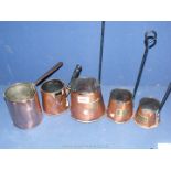 A set of three brass/copper cider measures and two Victorian copper milk pourers.