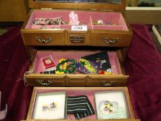 A jewellery box and contents including earrings, bracelets and rings, etc.