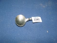 A continental silver Caddy Spoon.