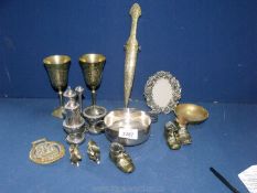 A quantity of brass including goblets, condiment, boots, dish and letter opener.