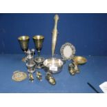 A quantity of brass including goblets, condiment, boots, dish and letter opener.