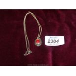 A very pretty silver necklace with red stone to centre marked 925.