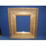 A heavy Victorian gilt gesso picture frame.