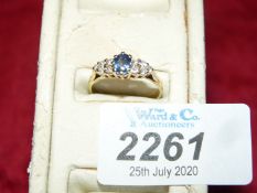 An 18 ct sapphire and diamond ring hallmarked size 'N 1/2'.