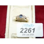 An 18 ct sapphire and diamond ring hallmarked size 'N 1/2'.