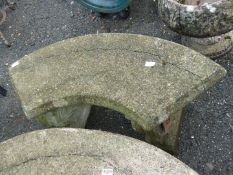 Crescent shaped concrete garden seat