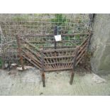 A wrought iron fire grate,