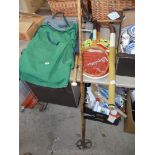 Hiking backpack, tennis rackets, hockey stick and old ski pole.