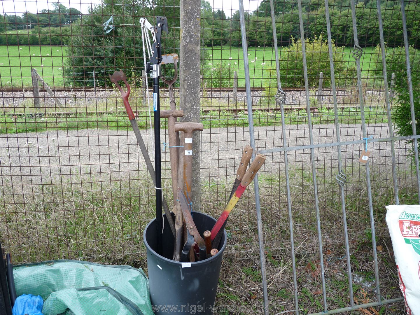 Bin of garden forks, spades,