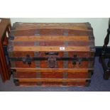 Wooden domed top travel trunk, 28" long x 21" high x 18" deep.