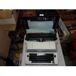A portable electric typewriter.