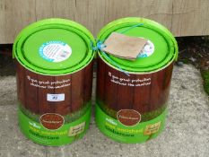 Two tubs of Timber Care