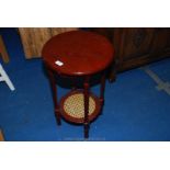 Circular wine table with cane under shelf 25" high x 16" diameter.