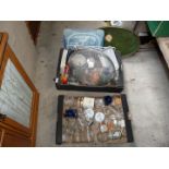 Two boxes of kitchen glassware, various drinking glasses, trays and cook books.