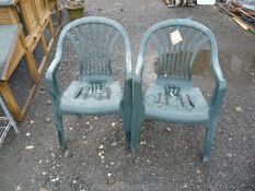 Two green garden patio chairs