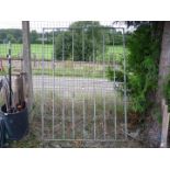 Nine stay metal gate with basket design, 53'' wide x 70'' high.