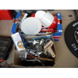 Two boxes of kitchenware including plastic pots, cutlery, tart tins, other tins etc.