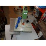 A Rexon BS 12RA band-saw with accessories plus work table.