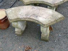 Crescent shaped concrete garden seat