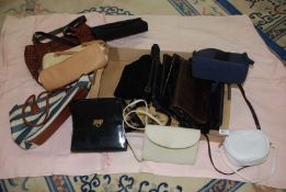 Box of miscellaneous handbags and shopping bags.