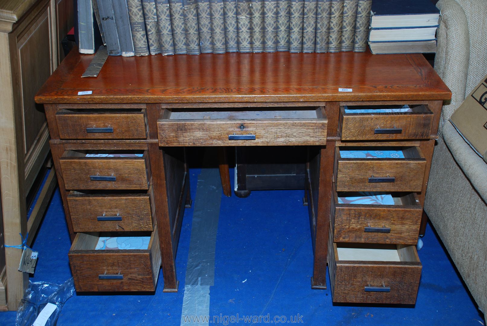 Office desk with graduated drawers, 48" long x 24" deep x 30" high.