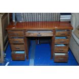 Office desk with graduated drawers, 48" long x 24" deep x 30" high.