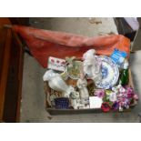Box of china figurines, vases and roll of rubber matting.