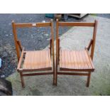 Pair of wooden folding chairs, one a/f.