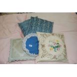 Quantity of embroidered cushions.
