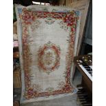 A patterned rug 86'' long x 50'' wide, a/f.