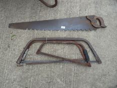 Three old bow saws and a rough cut hand saw/rip-saw.