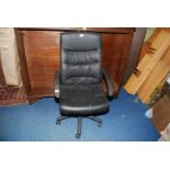 Faux leather swivel office chair (small rip to seat).