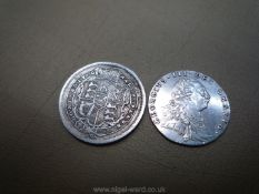 An 1816 George III shilling and a 1787 George III sixpence.