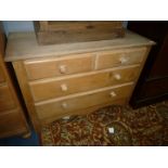 A Pine Chest of two long and two short Drawers having turned knobs,