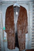 A fur coat by Renomax, Broad Street, Ross on Wye, single hook fastening.