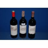 Three bottles of red wine including two of Chateau Du Glana Saint Julien 1988 and a bottle of